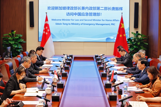 王祥喜会见新加坡律政部长兼 内政部第二部长唐振辉